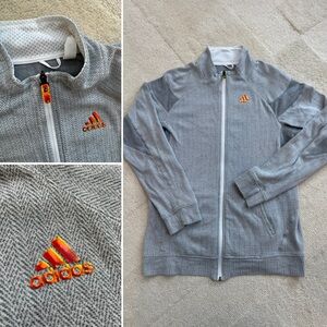 Adidas full zip light jacket size medium grey Fabric and reflective adidas logo